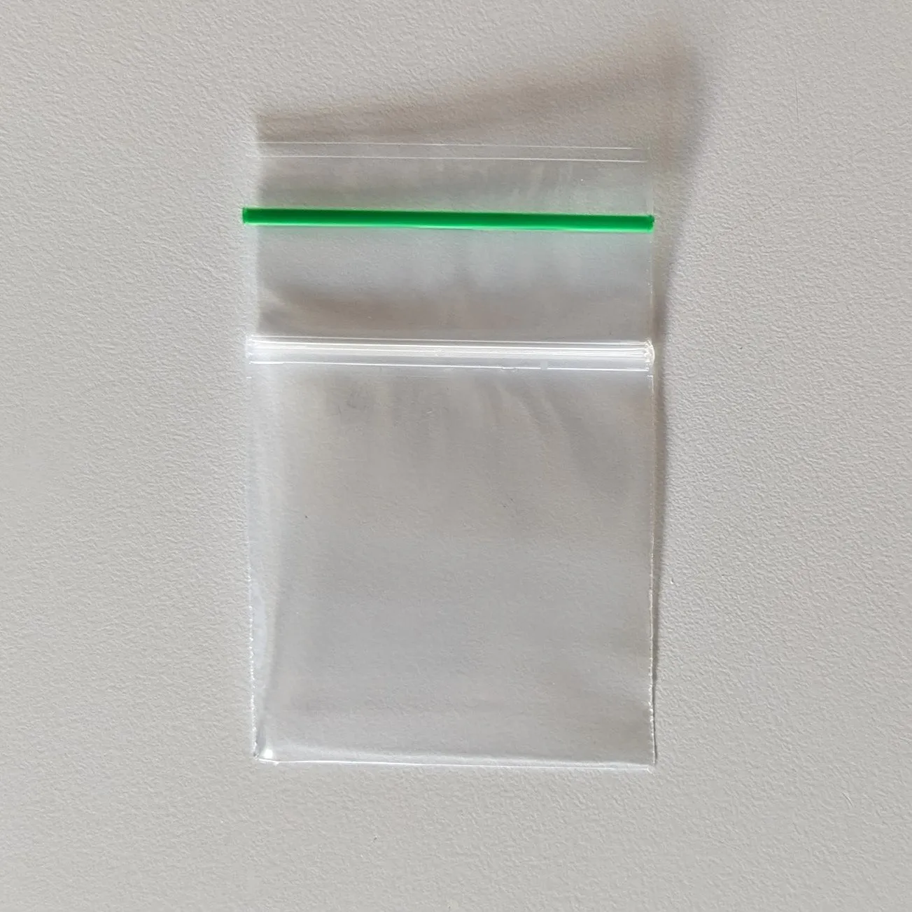 2" x 2" x 2 mil XX-Small Clear Landfill-Biodegradable Plastic Ziplock Bags with Resealable Zipper, Green Line (Pack of 100)